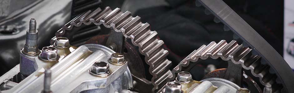 Close up of timing belts on gears inside a vehicle