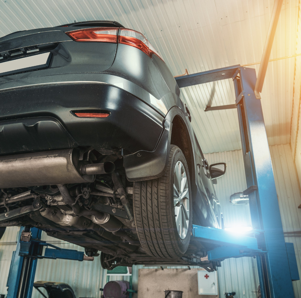 Vehicle up on an MOT ramp - MOT Testing Plymouth